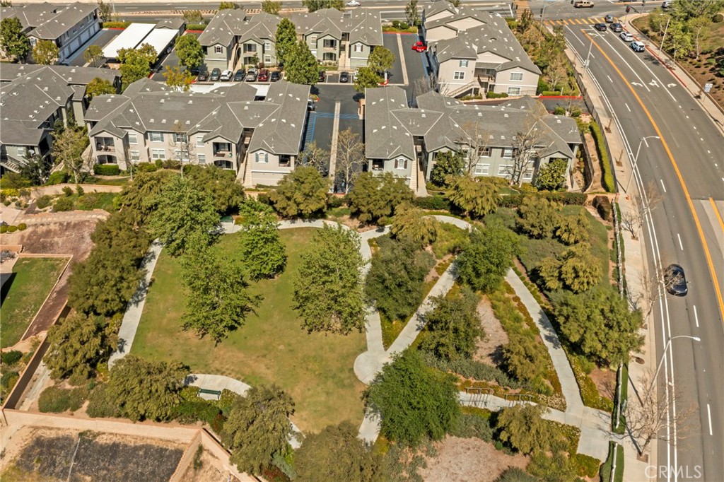 20000 Plum Canyon Road, Unit 1722 Saugus, CA 91350 - Photo 27 of 30 a view of residential houses with yard