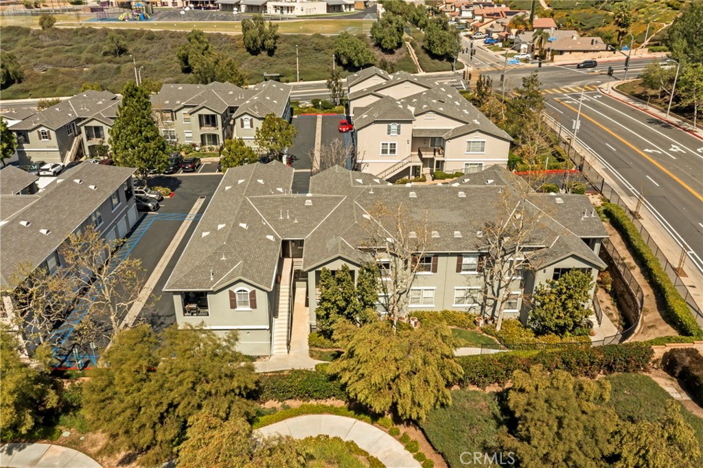 20000 Plum Canyon Road, Unit 1722 Saugus, CA 91350 - Photo 28 of 30 an aerial view of residential houses with outdoor space
