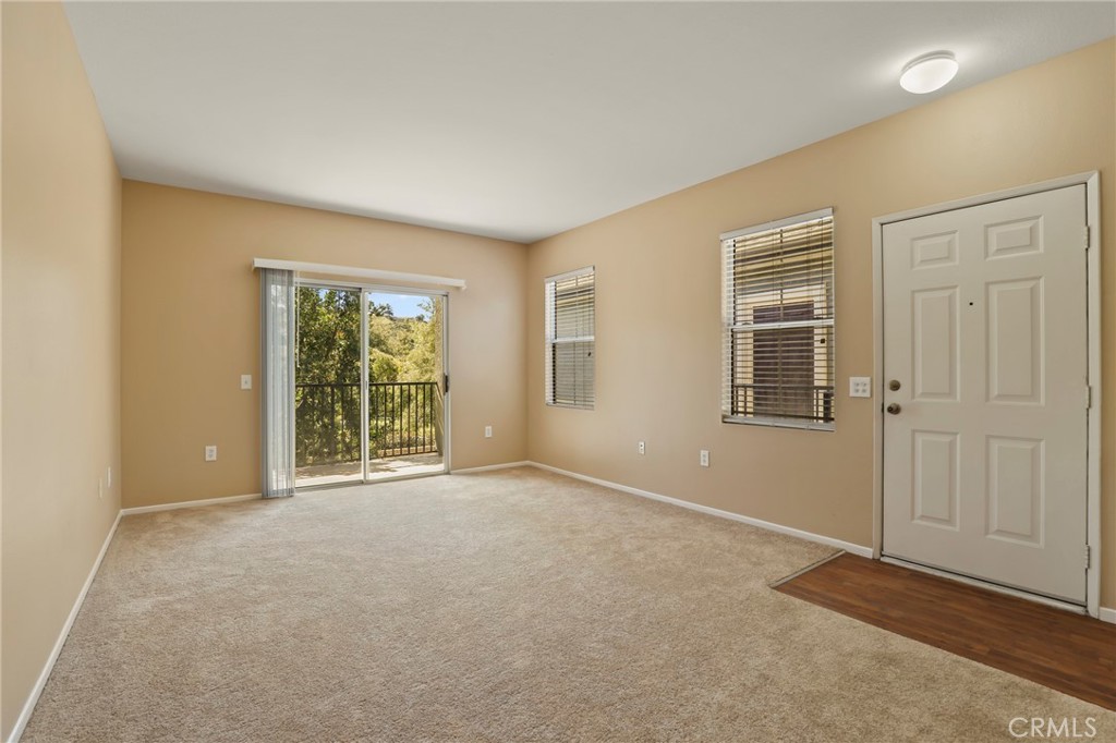 20000 Plum Canyon Road, Unit 1722 Saugus, CA 91350 - Photo 4 of 30 a view of an empty room with a window