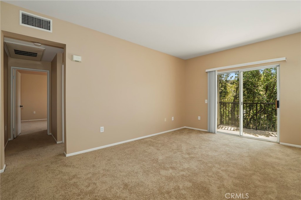 20000 Plum Canyon Road, Unit 1722 Saugus, CA 91350 - Photo 5 of 30 a view of an empty room with a window