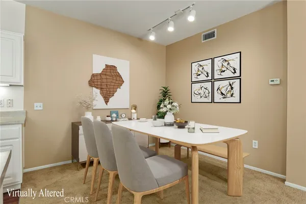 a view of a dining room with furniture