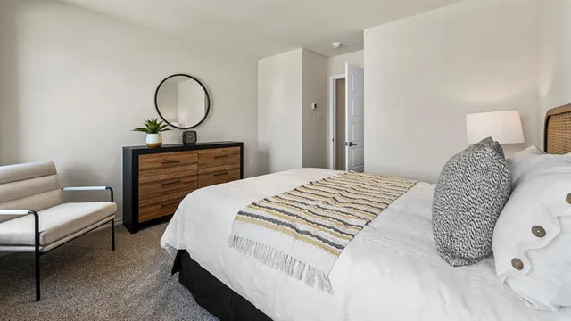 a bedroom with a large bed and closet