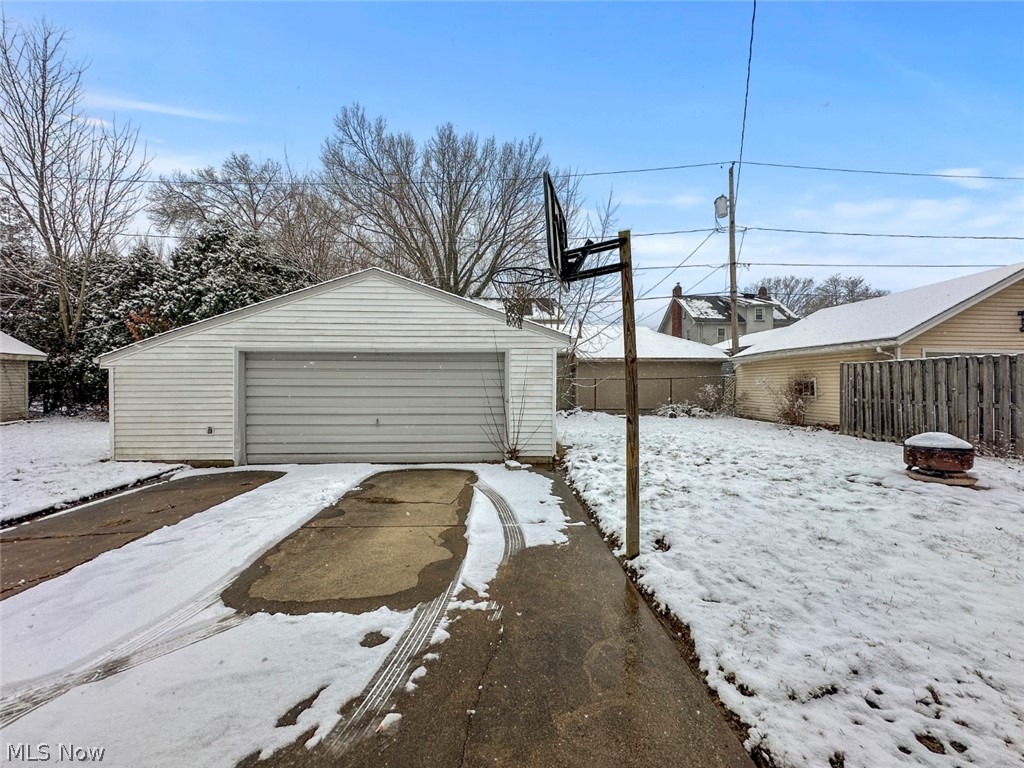 32 Como Street Struthers, OH 44471 - Photo 4 of 22 Snow covered garage featuring a garage