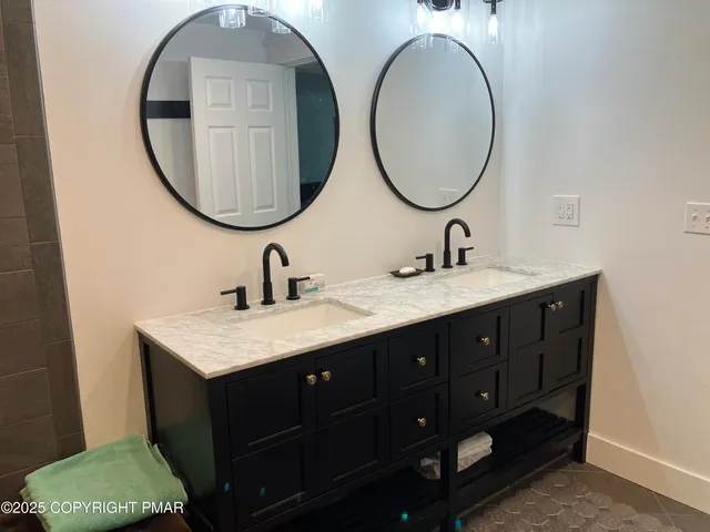 a view of a deck with wooden floor and fence with a garden
