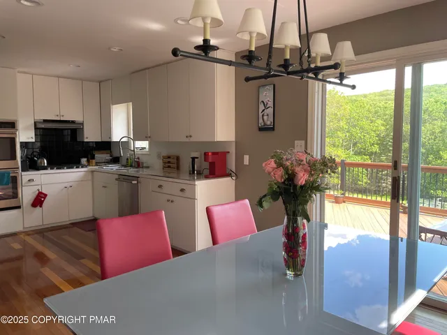 a view of a dining room with furniture window and outside view