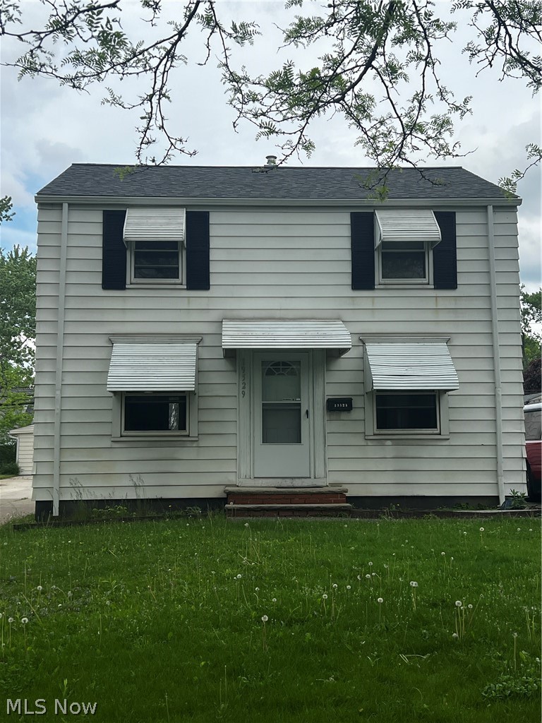 19529 Libby Road Maple Heights, OH 44137 - Photo 1 of 13 View of front facade with a front lawn