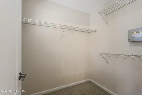 a view of a room with racks on the wall