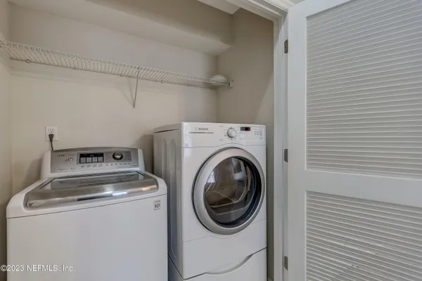 a utility room with dryer and washer