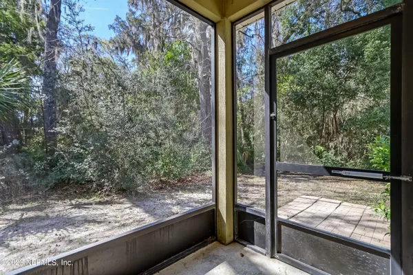 a view of a porch and a yard