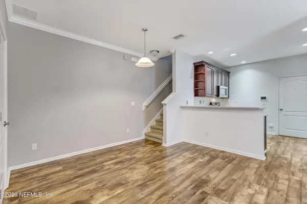 a view of a room with a sink and dishwasher