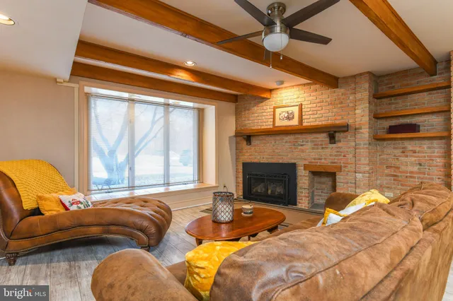 a bedroom with furniture and a fireplace