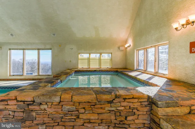 a view of a golf course with a swimming pool