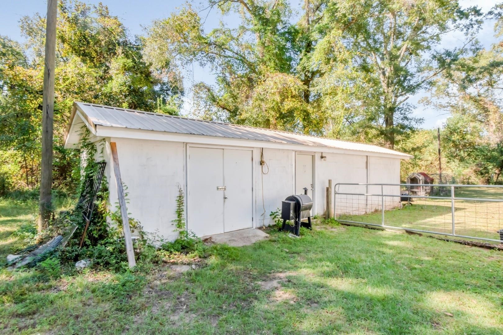 6405 1st Street Wilmer, AL 36587 - Photo 17 of 38 View of outdoor structure featuring view of wooded area