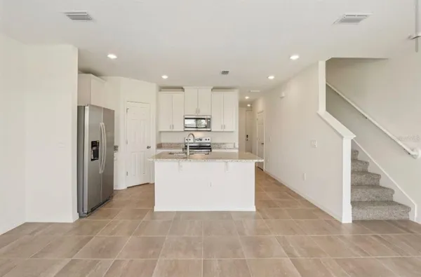 a kitchen that has a sink and a stove