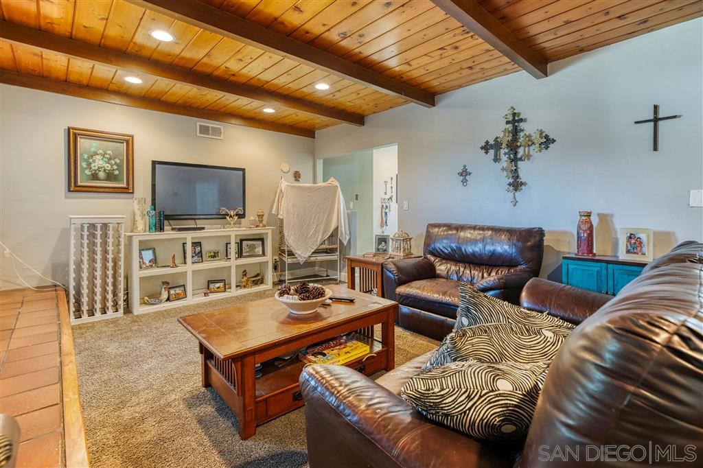 1906 Tavern Road Alpine, CA 91901 - Photo 4 of 16 a living room with furniture and a flat screen tv