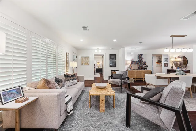 a living room with furniture and a table