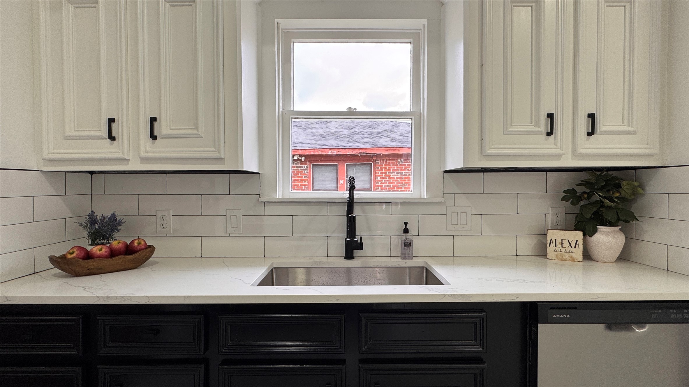1569 Elliott Street Houston, TX 77023 - Photo 14 of 14 a kitchen with stainless steel appliances a sink dishwasher window and cabinets