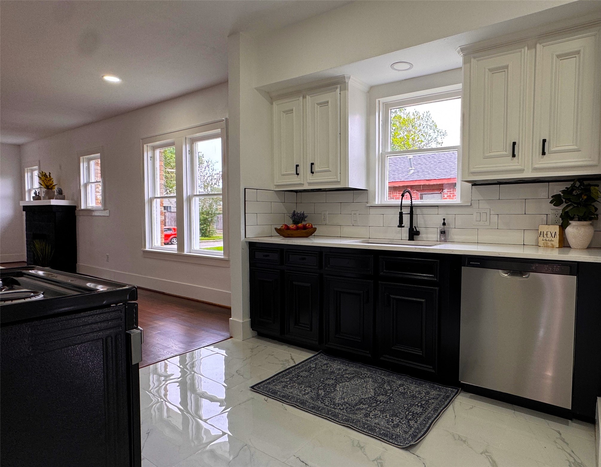 1569 Elliott Street Houston, TX 77023 - Photo 5 of 14 a kitchen with a sink stove and cabinets