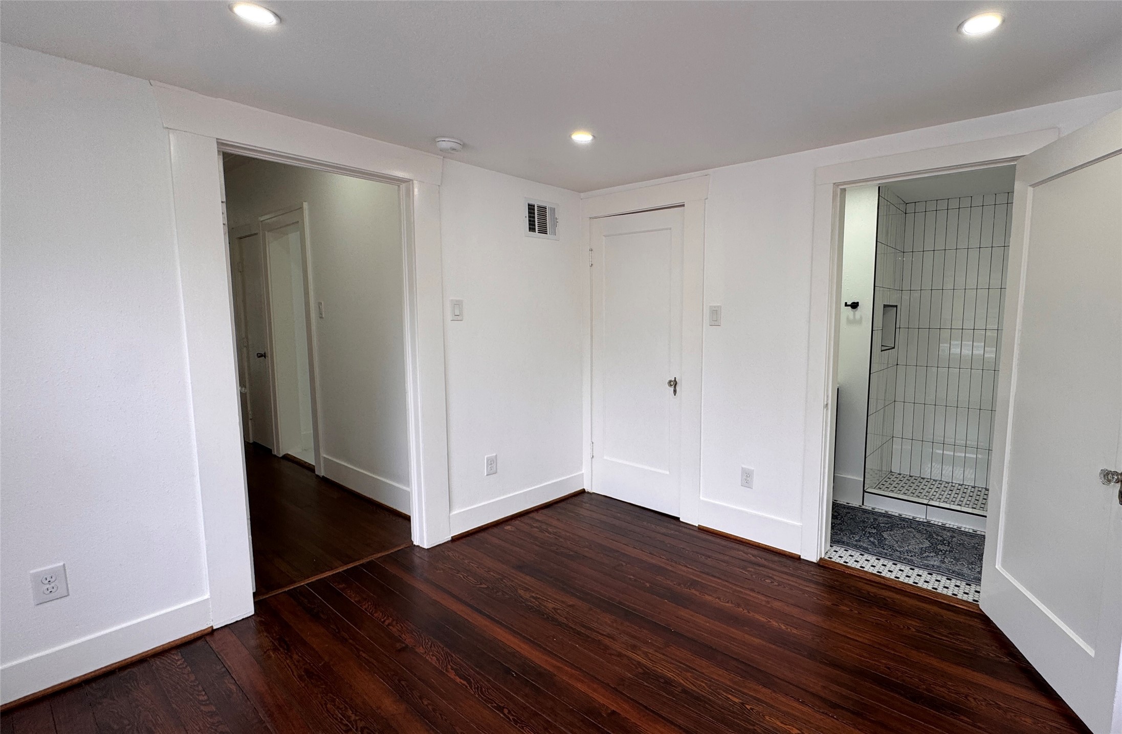 1569 Elliott Street Houston, TX 77023 - Photo 7 of 14 a view of an empty room with wooden floor