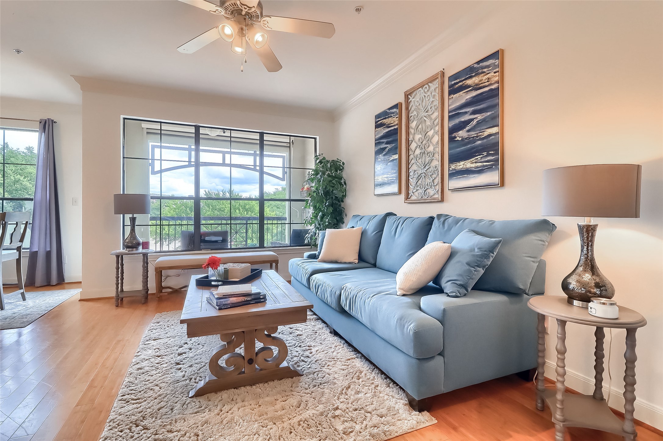 7701 Rialto Boulevard, Unit 1128 Austin, TX 78735 - Photo 2 of 35 a living room with furniture and a large window