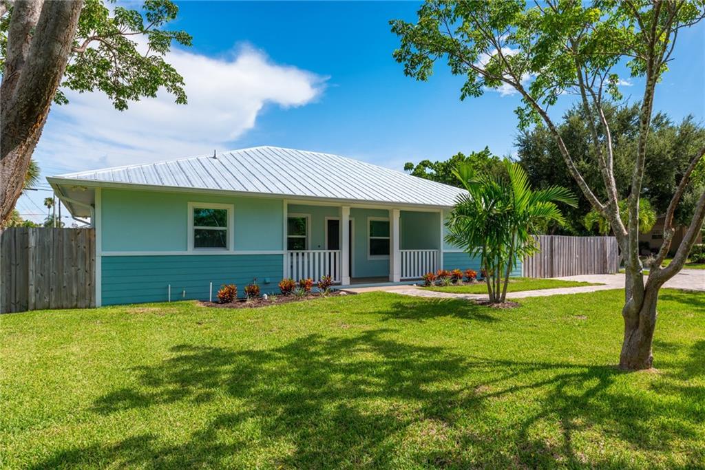 5111 Southeast Post Terrace Stuart, FL 34997 - Photo 1 of 34 a view of a house with a yard and sitting area