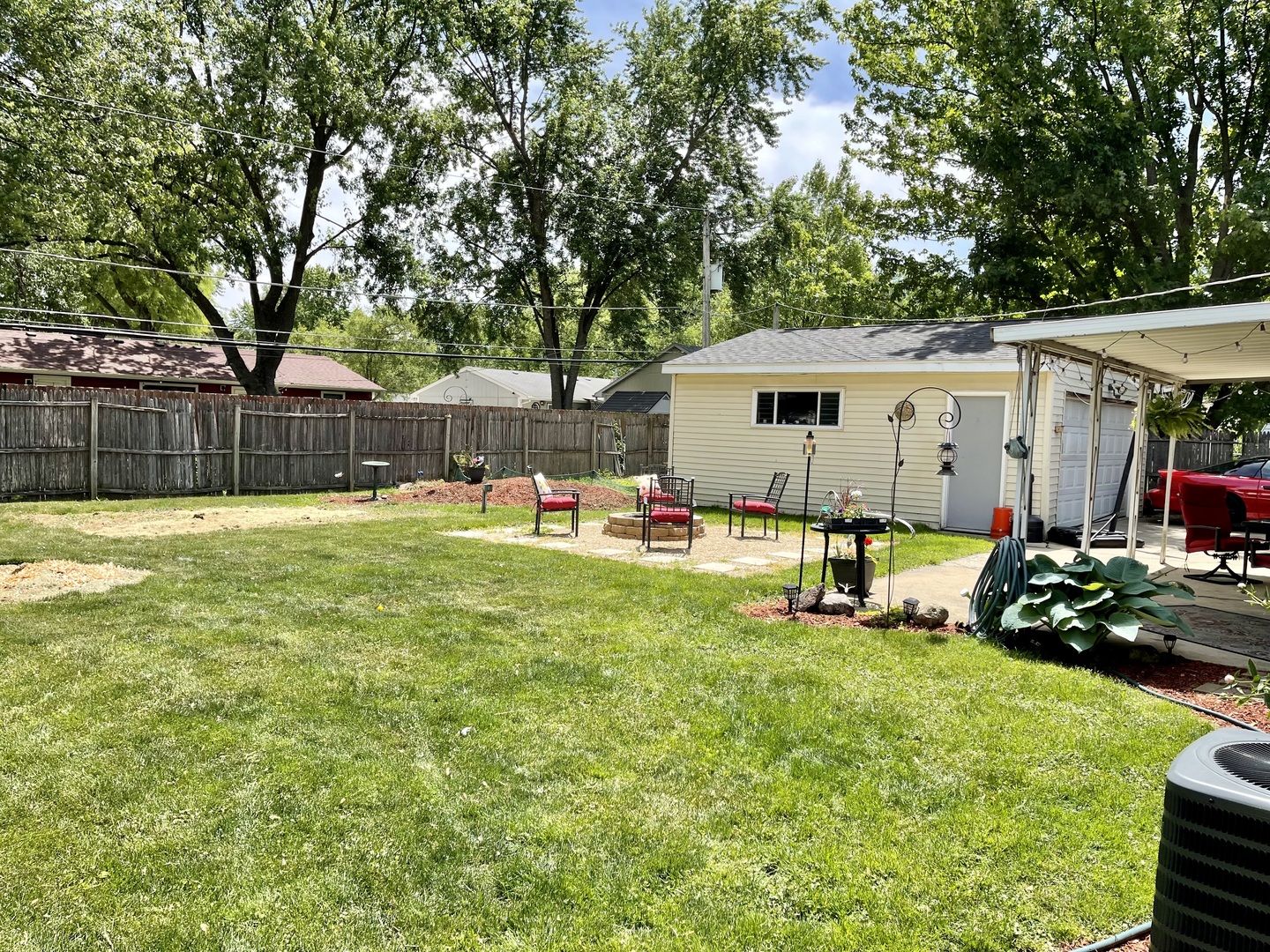 63 Stratford Road Montgomery, IL 60538 - Photo 17 of 24 a view of a house with a yard patio and a tree