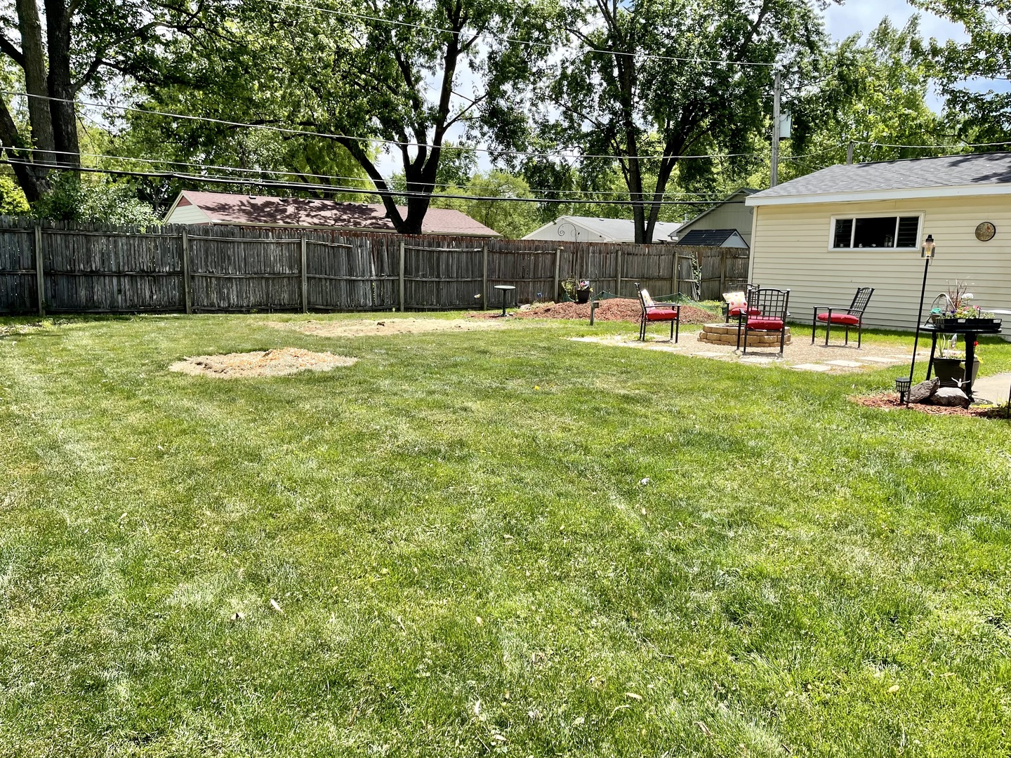 63 Stratford Road Montgomery, IL 60538 - Photo 18 of 24 a view of a backyard with a garden