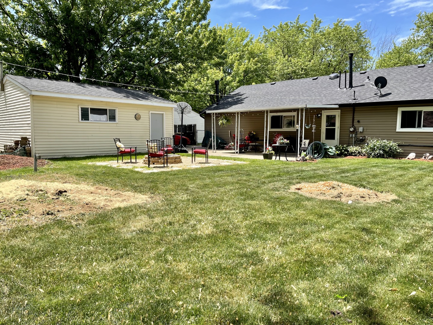 63 Stratford Road Montgomery, IL 60538 - Photo 20 of 24 a front view of a house with swimming pool having outdoor seating