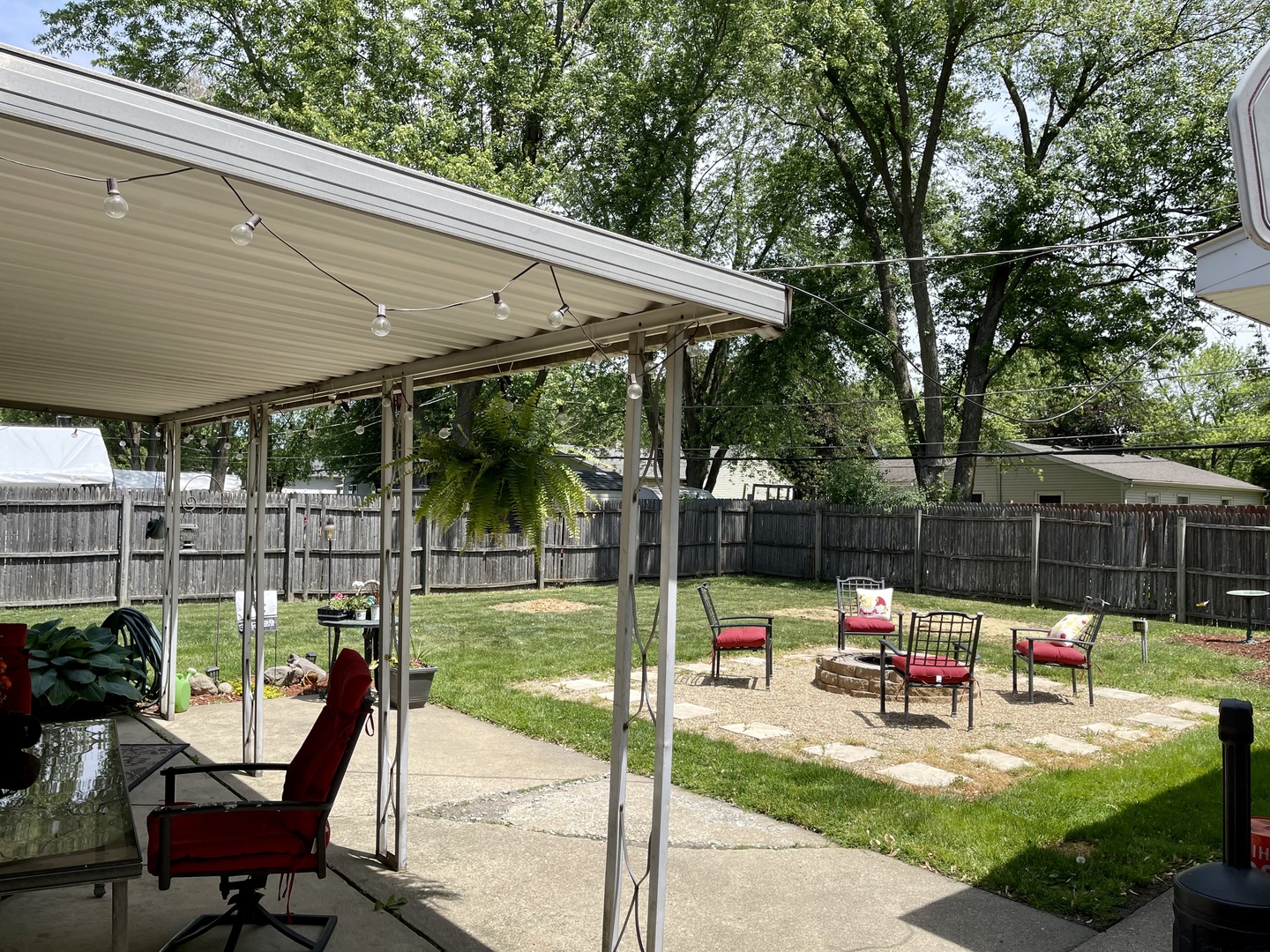 63 Stratford Road Montgomery, IL 60538 - Photo 22 of 24 a garden view with a seating space
