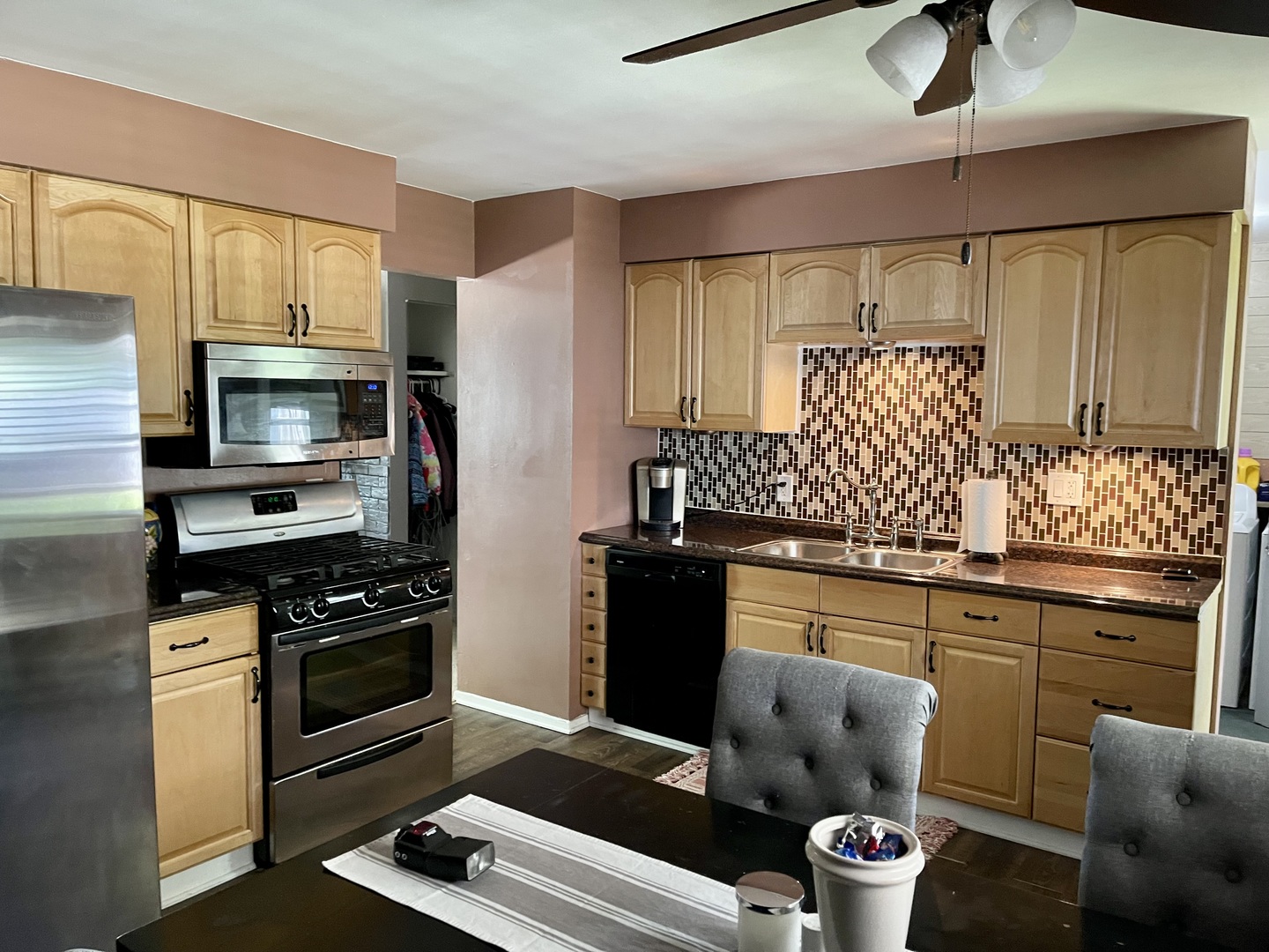 63 Stratford Road Montgomery, IL 60538 - Photo 6 of 24 a kitchen with stainless steel appliances a stove refrigerator and cabinets