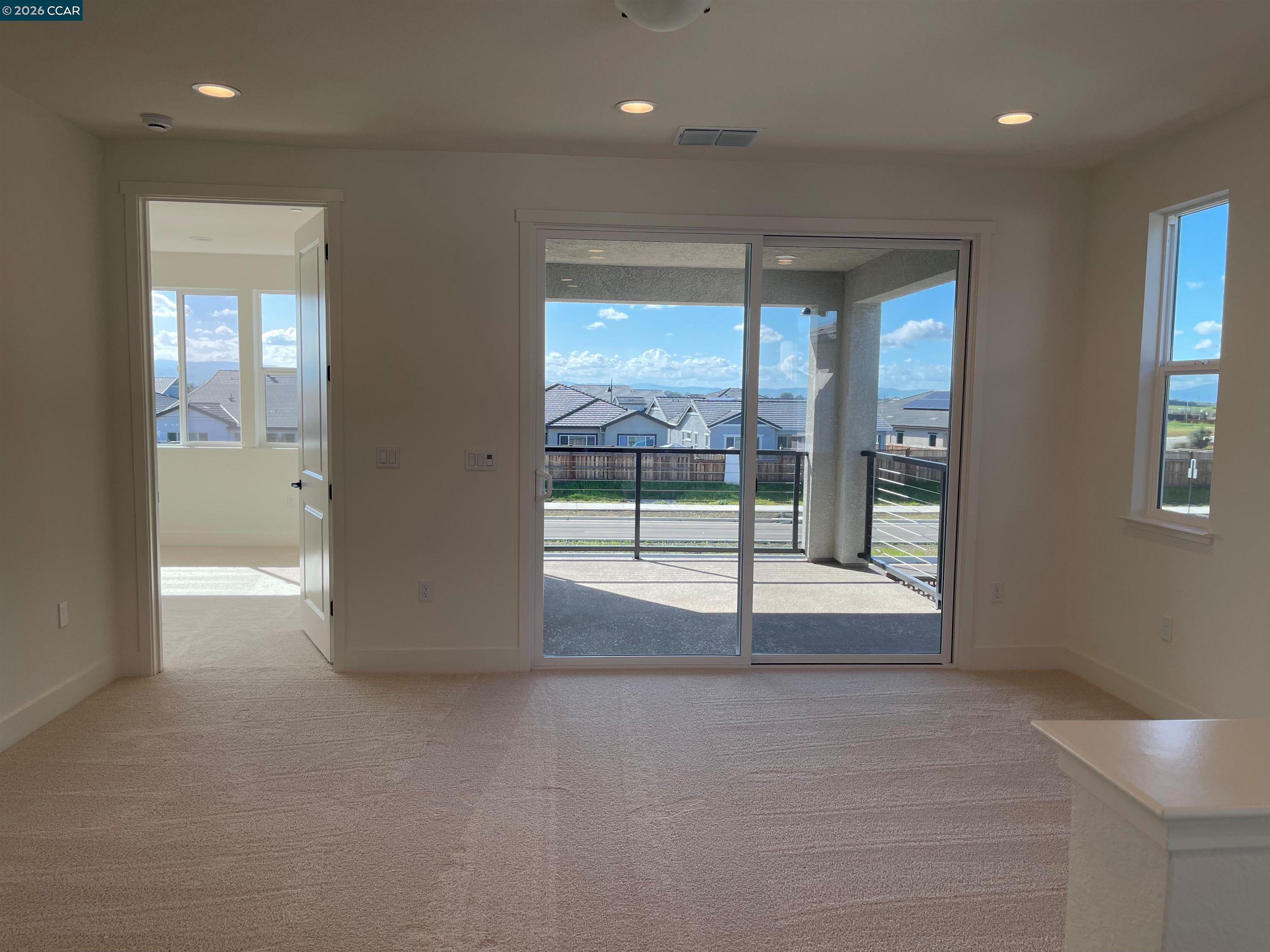17549 Bushwick Lane Lathrop, CA 95330 - Photo 6 of 10 a view of an empty room with glass door and a window