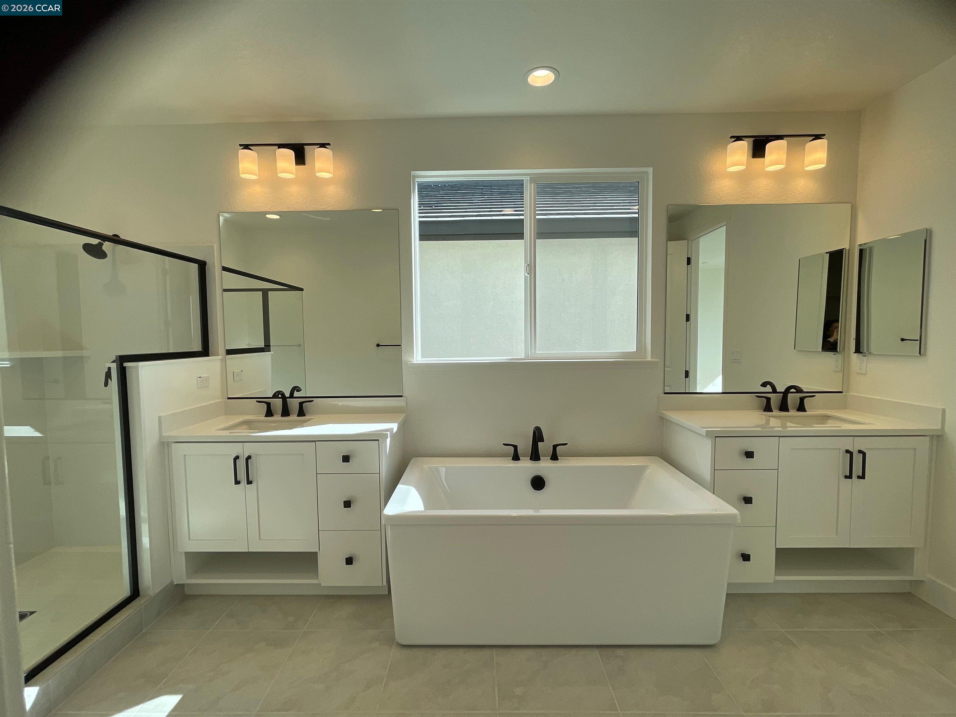 17549 Bushwick Lane Lathrop, CA 95330 - Photo 9 of 10 a bathroom with a double vanity sink mirror and bathtub