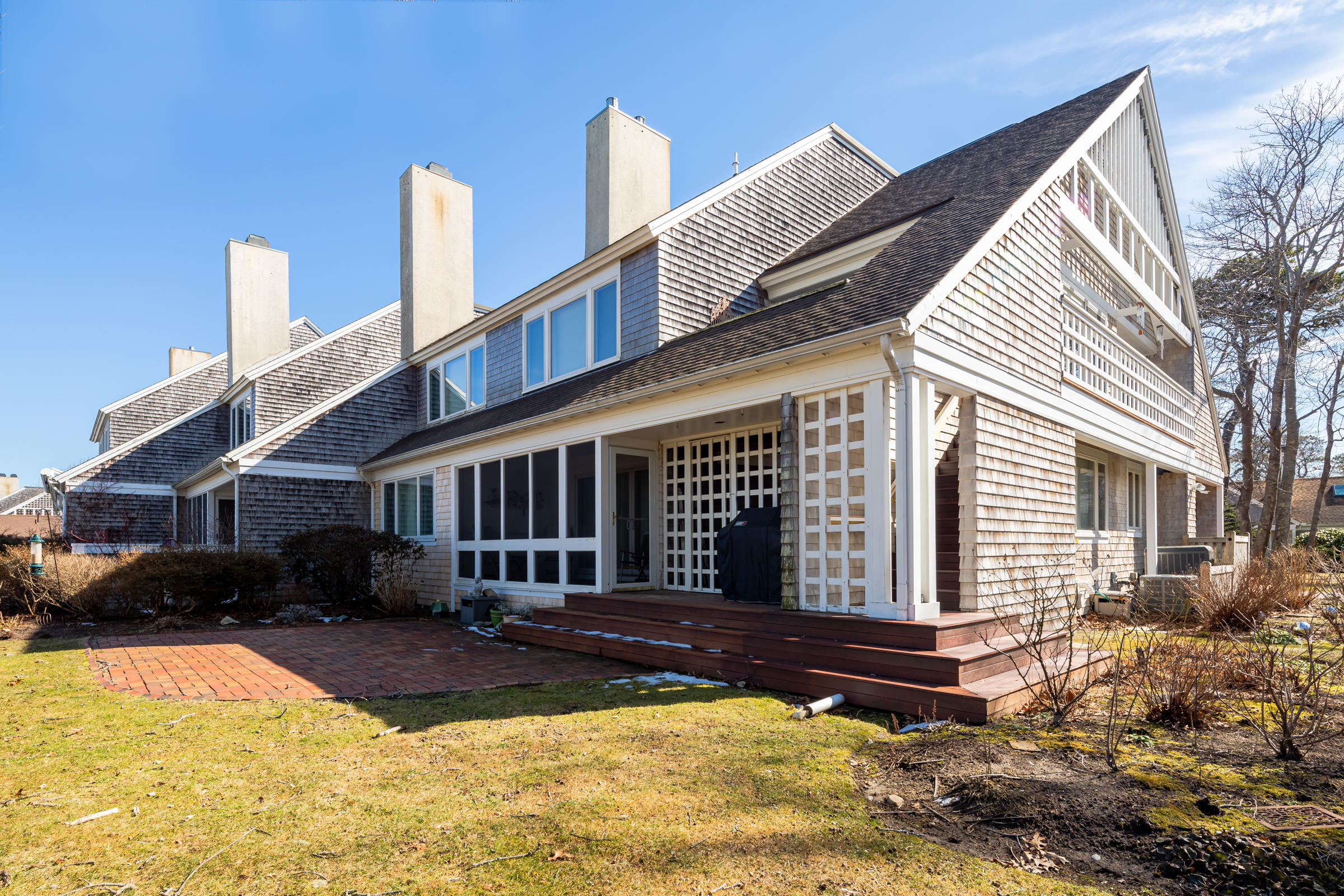 a view of a house with a yard and sitting area