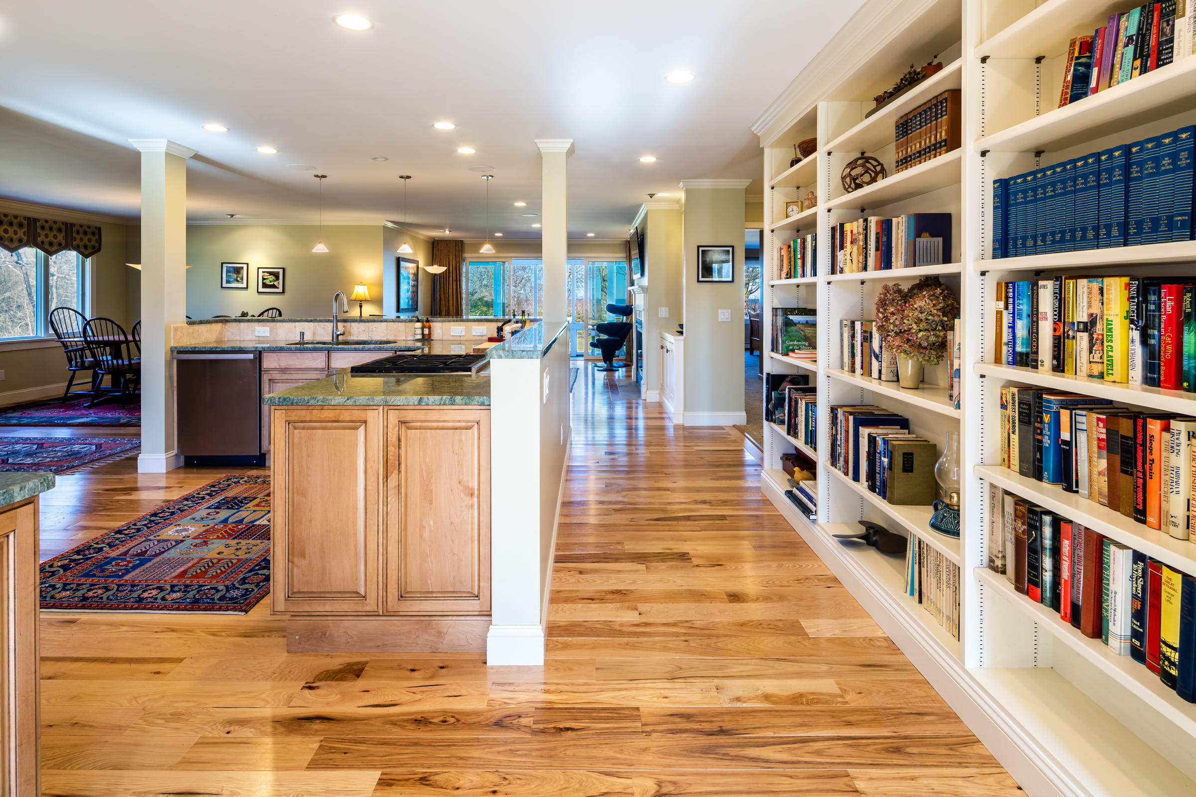 31 Wheeler Drive Brewster, MA 02631 - Photo 11 of 39 a living room with lots of furniture and a book shelf