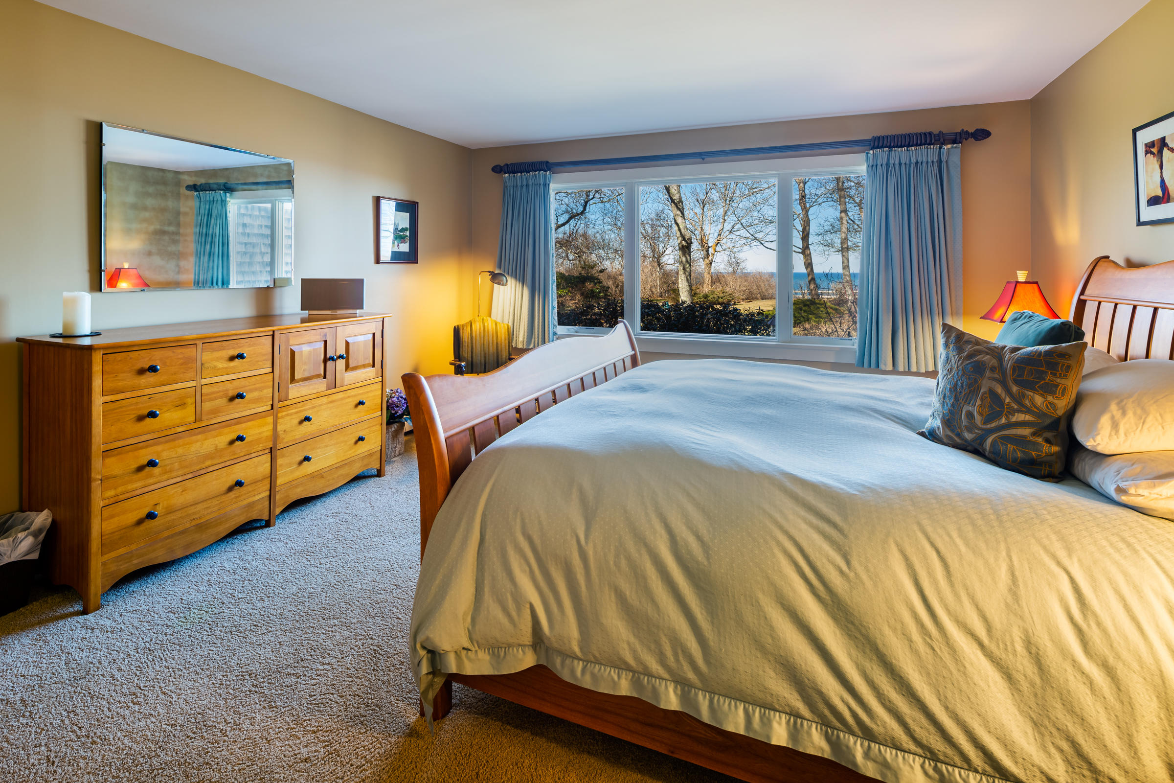 31 Wheeler Drive Brewster, MA 02631 - Photo 26 of 39 a bedroom with a bed and large windows