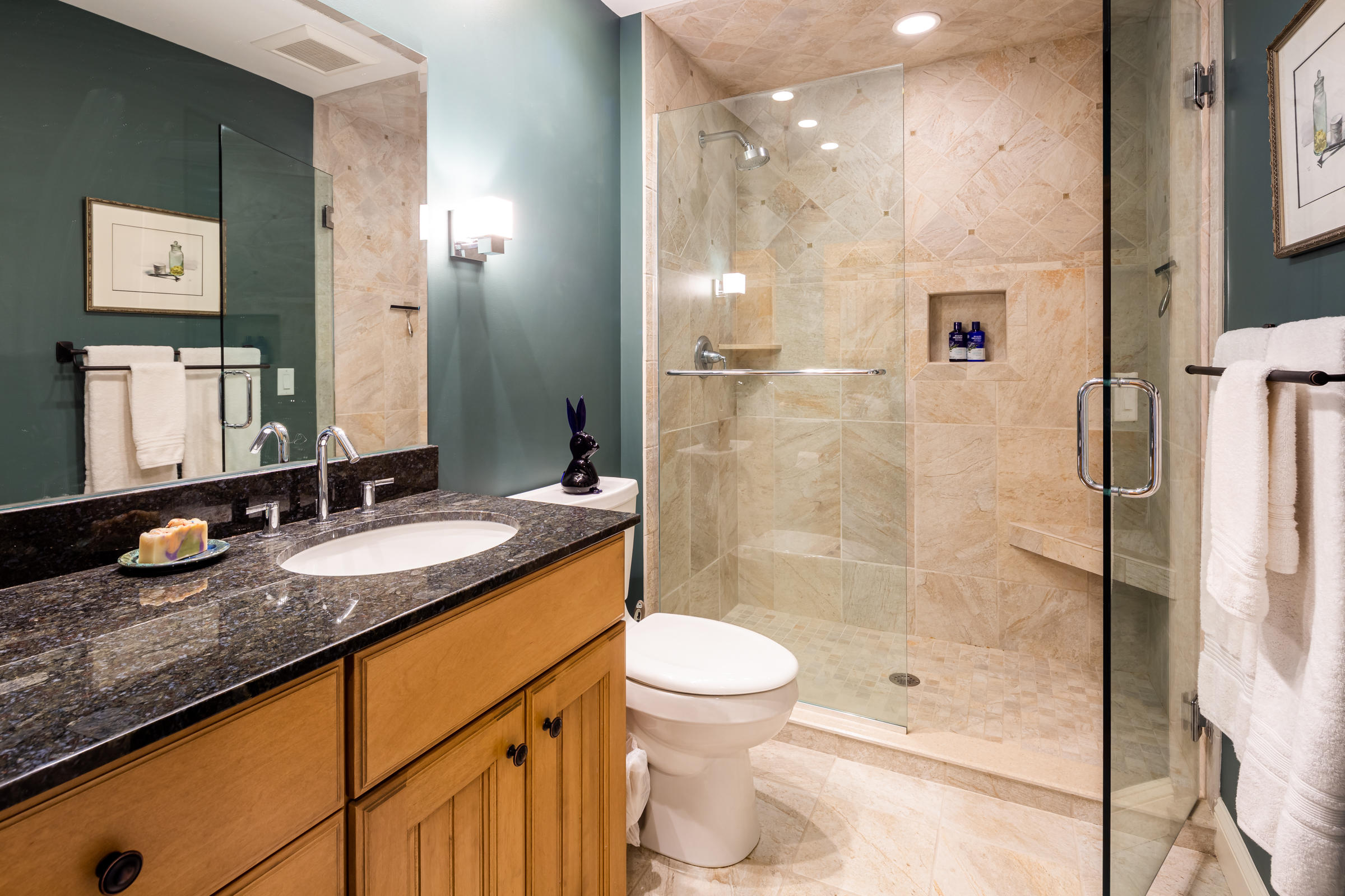 31 Wheeler Drive Brewster, MA 02631 - Photo 30 of 39 a bathroom with a granite countertop sink a toilet a mirror and shower