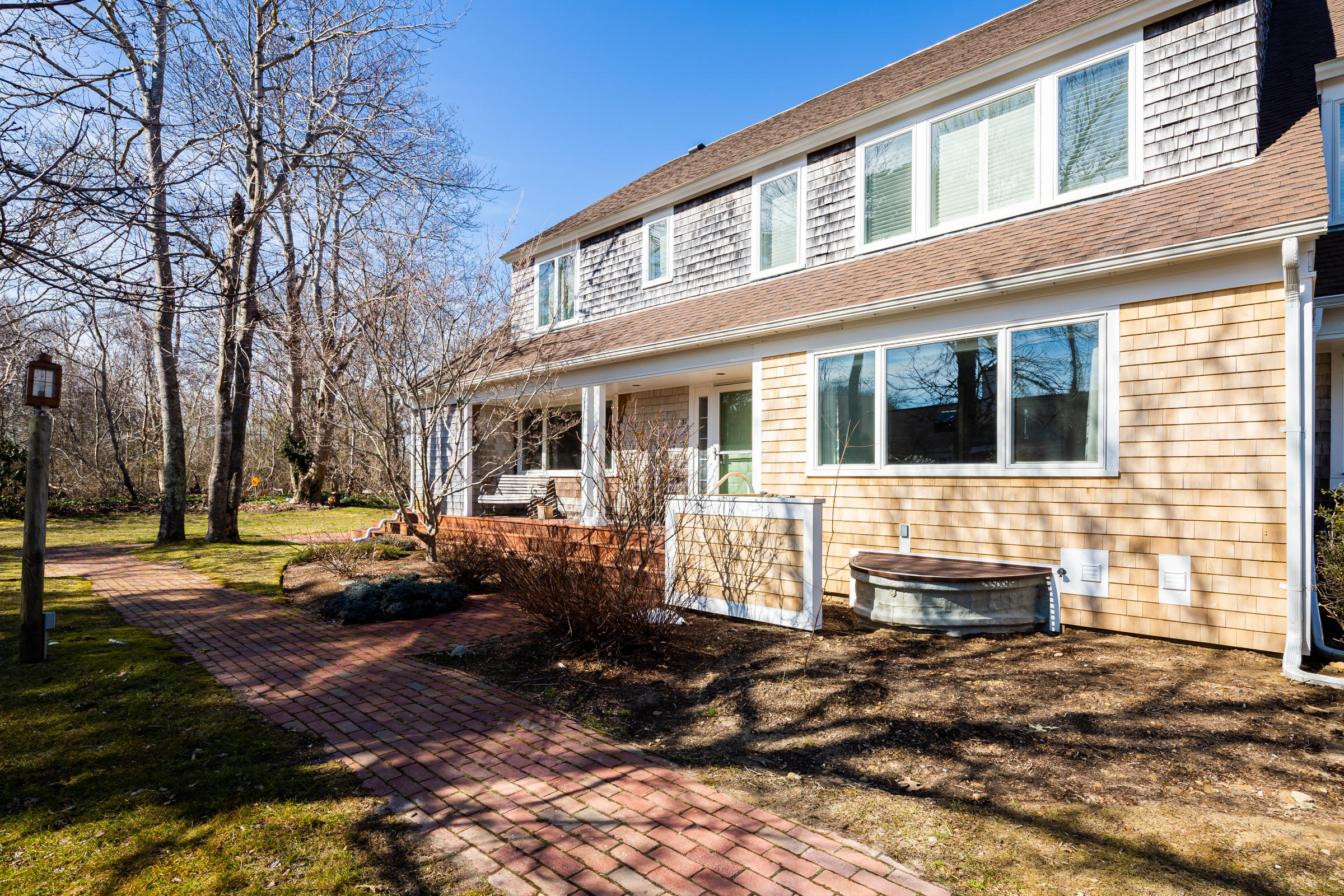31 Wheeler Drive Brewster, MA 02631 - Photo 3 of 39 a front view of a house with a yard