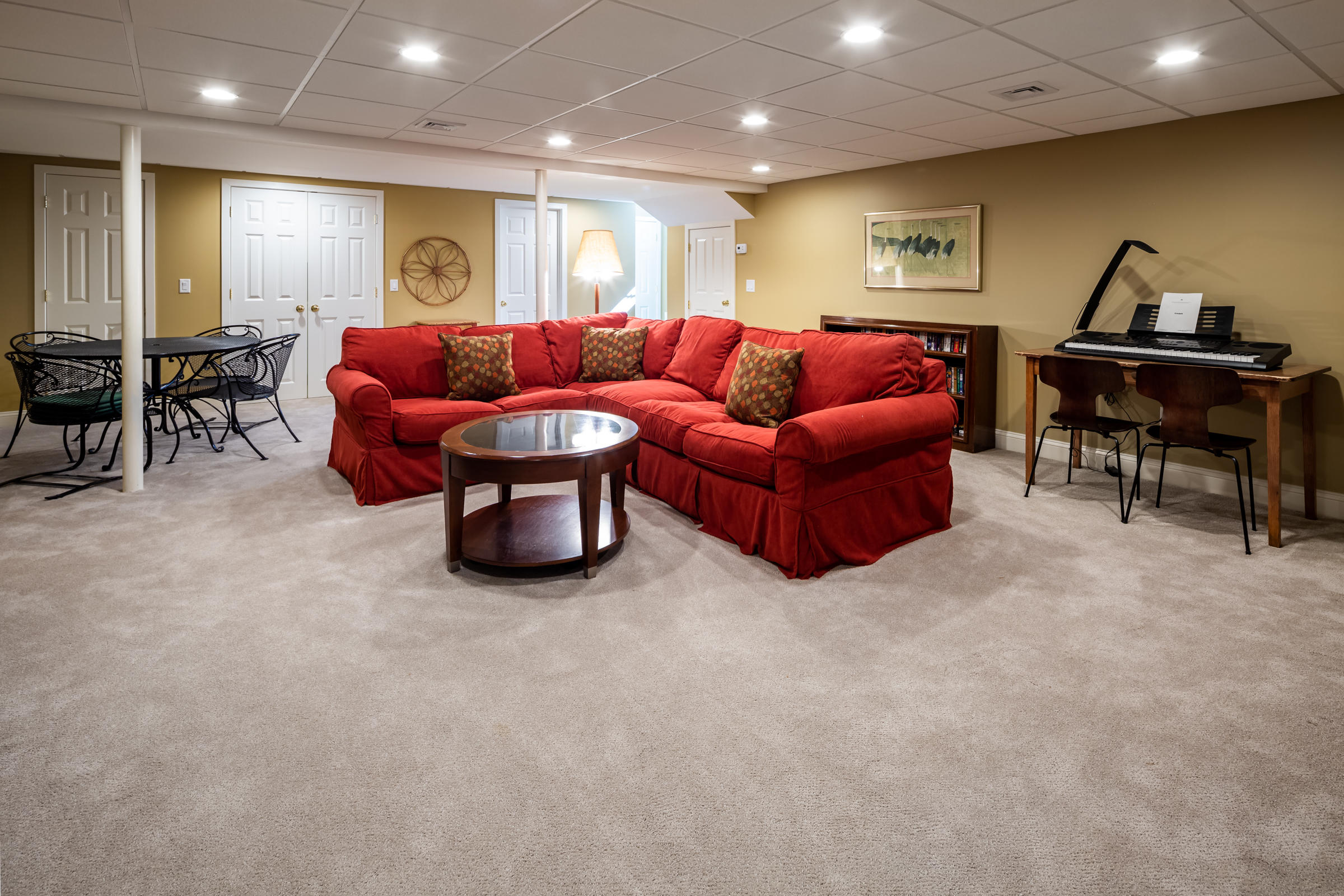 31 Wheeler Drive Brewster, MA 02631 - Photo 33 of 39 a living room with furniture a wooden floor and a piano