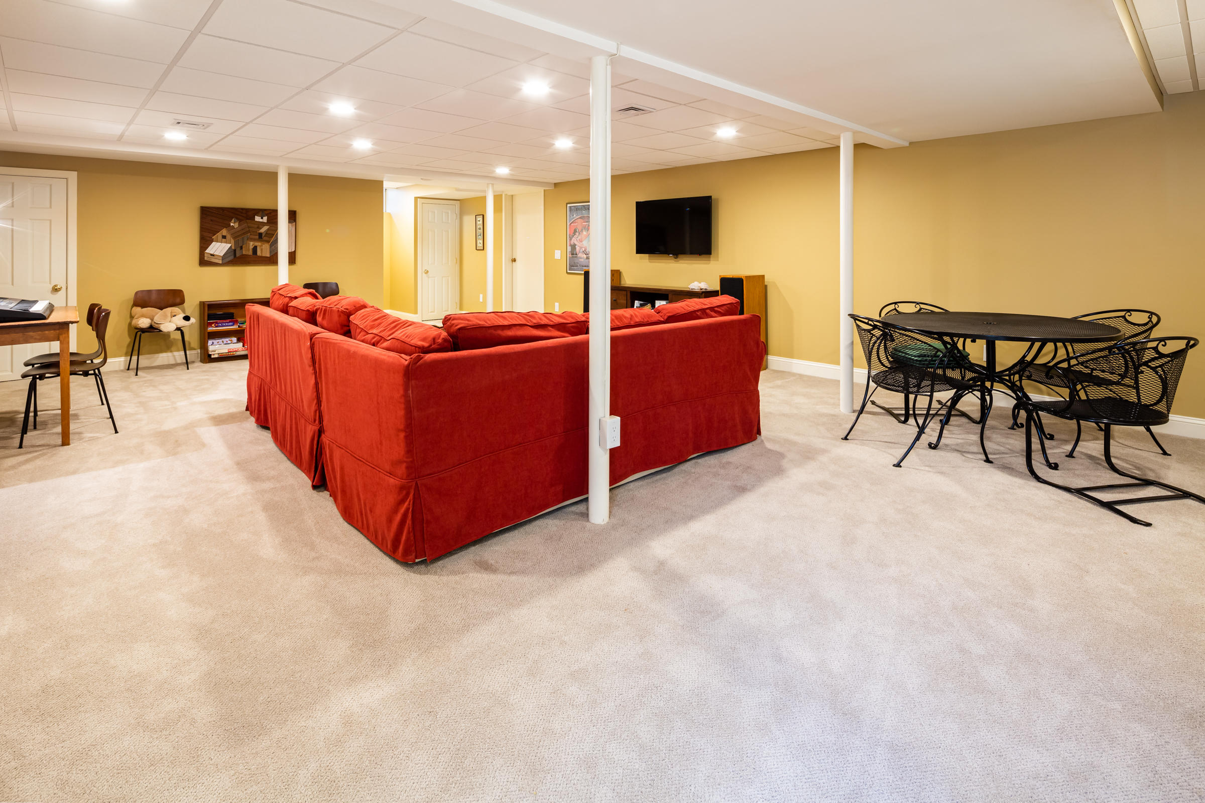 31 Wheeler Drive Brewster, MA 02631 - Photo 34 of 39 a living room with furniture and a flat screen tv