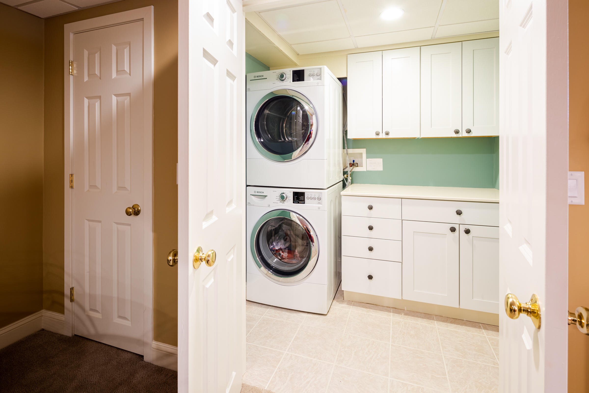 31 Wheeler Drive Brewster, MA 02631 - Photo 35 of 39 a utility room with dryer and washer