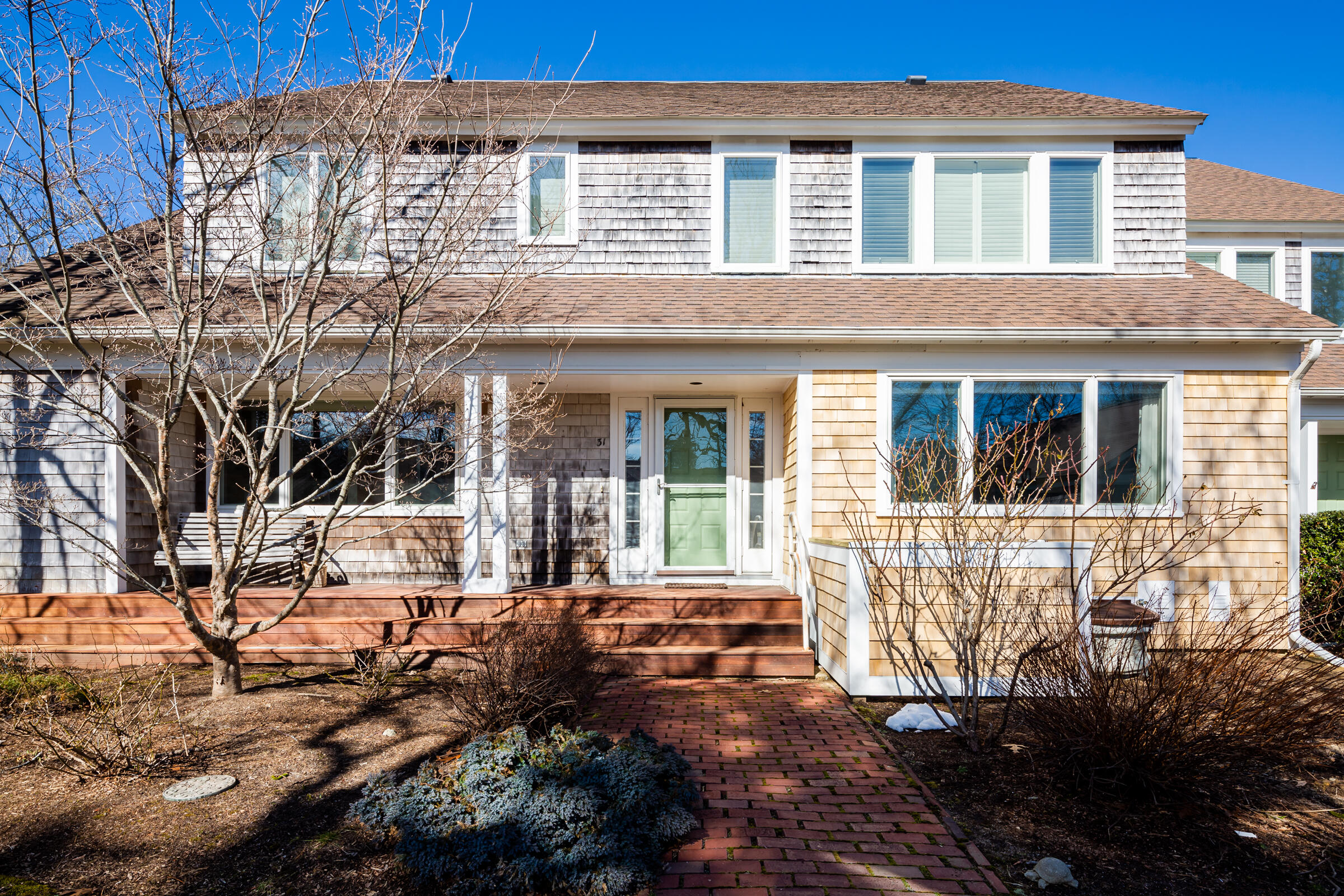 31 Wheeler Drive Brewster, MA 02631 - Photo 4 of 39 a front view of a house with a yard