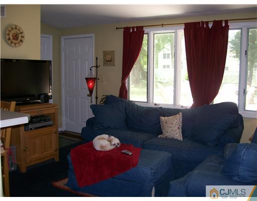 21 Maida Road Edison, NJ 08820 - Photo 8 of 10 a living room with furniture and a flat screen tv