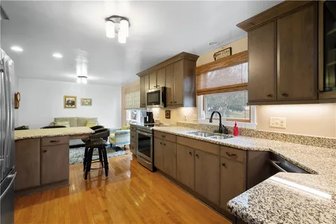 a kitchen with sink cabinets and dining table