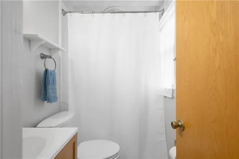 a bathroom with a toilet and a sink