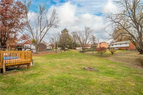 a view of yard with swimming pool