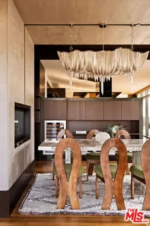 a kitchen with stainless steel appliances granite countertop a refrigerator and a stove