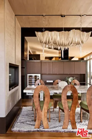 a kitchen with stainless steel appliances granite countertop a refrigerator and a stove
