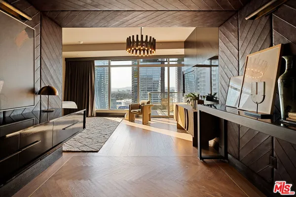 a bedroom with a large bed and ceiling fan