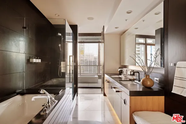a bathroom with a sink and mirror