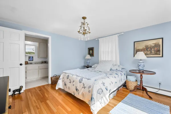 a bedroom with a bed and a table